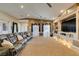 Expansive living room with carpet, seating, and built-in shelving at 2817 High View Dr, Henderson, NV 89014