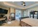 Well-lit main bedroom features a workstation, access to the patio, and an ensuite bathroom at 2817 High View Dr, Henderson, NV 89014