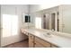 Bathroom featuring a vanity with drawers and cabinets, a large mirror and neutral finishes at 3740 Desert Marina Dr # 7, Laughlin, NV 89029