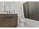 Bathroom with dark wood vanity, bathtub, and shower at 437 Cascade Heights Ave, Las Vegas, NV 89138