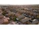 Expansive aerial view of a well-planned community, showcasing neatly arranged homes and streetscapes at 4920 Blue Rose St, North Las Vegas, NV 89081