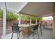 Covered patio area with outdoor furniture, perfect for entertaining and relaxation at 4920 Blue Rose St, North Las Vegas, NV 89081