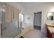 Serene bathroom featuring a soaking tub, glass shower, and stylish fixtures at 4920 Blue Rose St, North Las Vegas, NV 89081