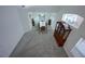 A spacious dining room with high ceilings, neutral colors, and large windows for ample natural light at 4920 Blue Rose St, North Las Vegas, NV 89081