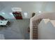 Open foyer featuring a stairway, dining table and skylight, providing bright natural light at 4920 Blue Rose St, North Las Vegas, NV 89081