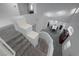 Stylish foyer with a view of the dining area, showcasing an open staircase at 4920 Blue Rose St, North Las Vegas, NV 89081