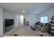 A spacious living room is filled with natural light and has a contemporary sofa at 4920 Blue Rose St, North Las Vegas, NV 89081