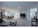 Spacious open-concept living room and kitchen for easy entertaining and modern living at 4920 Blue Rose St, North Las Vegas, NV 89081