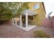 Inviting covered patio with ample seating space, perfect for outdoor entertaining and relaxation at 4920 Blue Rose St, North Las Vegas, NV 89081