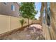 Landscaped backyard with stone and privacy fence at 4977 Crimson Mare Rd, Las Vegas, NV 89139