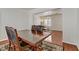 Spacious dining room with a dark wood table and a view into the living space at 4977 Crimson Mare Rd, Las Vegas, NV 89139