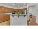 Bright kitchen island featuring a granite countertop, modern appliances, and ample cabinet space at 4977 Crimson Mare Rd, Las Vegas, NV 89139