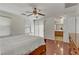 Bright main bedroom with hardwood floors and ensuite bathroom at 4977 Crimson Mare Rd, Las Vegas, NV 89139