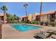 Refreshing community pool with lounge chairs at 5116 River Glen Dr # 224, Las Vegas, NV 89103