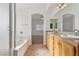 Double vanity bathroom with granite countertops and access to bedroom at 5857 Red Dawn St, North Las Vegas, NV 89031