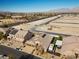 Nevada home featuring desert landscaping, a large driveway, and solar panels at 5944 Vizzi Ct, Las Vegas, NV 89131