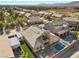 Aerial view of home, showcasing the backyard pool, fire pit, and lush landscaping at 5944 Vizzi Ct, Las Vegas, NV 89131