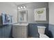 Simple bathroom with single sink, toilet, and wainscoting at 5944 Vizzi Ct, Las Vegas, NV 89131