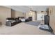 Spacious bedroom with seating area and carpeted floors, providing a comfortable and inviting retreat at 5944 Vizzi Ct, Las Vegas, NV 89131