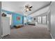 Primary bedroom with large windows, vaulted ceiling, and neutral carpet flooring at 5944 Vizzi Ct, Las Vegas, NV 89131