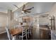 Elegant dining room with wood flooring, large table, and seamless flow to other spaces at 5944 Vizzi Ct, Las Vegas, NV 89131