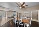Elegant dining room with wood flooring, large table, and seamless flow to other spaces at 5944 Vizzi Ct, Las Vegas, NV 89131