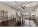 Charming dining room with wood floors, stylish table set, and natural light at 5944 Vizzi Ct, Las Vegas, NV 89131