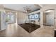 Inviting entryway with tiled floor, decorative glass door, and blue accent wall at 5944 Vizzi Ct, Las Vegas, NV 89131