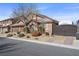 Charming home exterior with lush landscaping and gated driveway at 5944 Vizzi Ct, Las Vegas, NV 89131