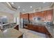 Well-equipped kitchen featuring granite counters, stainless appliances, and ample wood cabinetry at 5944 Vizzi Ct, Las Vegas, NV 89131