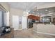 Spacious kitchen with stainless steel appliances, wood cabinets, and access to dining area at 5944 Vizzi Ct, Las Vegas, NV 89131
