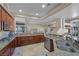 Modern kitchen with granite countertops, stainless steel appliances, and open layout at 5944 Vizzi Ct, Las Vegas, NV 89131