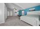 Spacious main bedroom showcasing an accent wall, plush carpeting, and a serene atmosphere at 5944 Vizzi Ct, Las Vegas, NV 89131