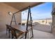 Covered patio area with rustic wooden dining set, perfect for outdoor gatherings and entertaining at 5944 Vizzi Ct, Las Vegas, NV 89131