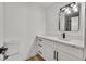 Modern bathroom with white cabinets, quartz countertop, and black matte fixtures at 6776 Arroyo Ave, Las Vegas, NV 89103