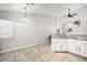 Spacious dining area with tile flooring and a view of the kitchen at 7921 Cadenza Ln, Las Vegas, NV 89123