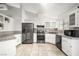 Updated kitchen featuring stainless steel appliances and granite counters at 7921 Cadenza Ln, Las Vegas, NV 89123