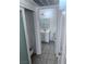 Bathroom view shows tiled floors, vanity, mirror and sink, toilet, and updated lighting at 1381 E University Ave # 102, Las Vegas, NV 89119