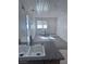 An updated kitchen with tiled floors and granite countertops offers a modern touch at 1381 E University Ave # 102, Las Vegas, NV 89119