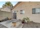 Private patio with potted plants and wrought iron gate at 1612 N Torrey Pines Dr # 101, Las Vegas, NV 89108