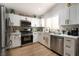 Modern kitchen with white cabinets and stainless steel appliances at 2179 Point Mallard Dr, Henderson, NV 89012