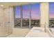 Elegant bathroom with city views, double sinks, and a glass shower at 222 Karen Ave # 1702, Las Vegas, NV 89109