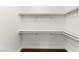 Large walk-in closet with double hanging rods and shelves at 222 Karen Ave # 1702, Las Vegas, NV 89109