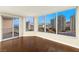 Living room with hardwood floors and expansive windows at 222 Karen Ave # 1702, Las Vegas, NV 89109