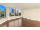 Bright living room with hardwood floors and large windows at 222 Karen Ave # 1702, Las Vegas, NV 89109