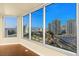 Living room with expansive windows offering stunning city views at 222 Karen Ave # 1702, Las Vegas, NV 89109