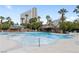 Resort-style pool with a shallow area and lounge chairs at 222 Karen Ave # 1702, Las Vegas, NV 89109