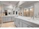 Luxurious bathroom with double vanity and a large walk-in shower at 2391 Dalewood Ave, North Las Vegas, NV 89086