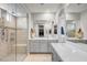 Large bathroom with double vanity, walk-in shower, and soaking tub at 2391 Dalewood Ave, North Las Vegas, NV 89086