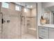 Spa-like bathroom featuring a large walk-in shower with a built-in seat at 2391 Dalewood Ave, North Las Vegas, NV 89086